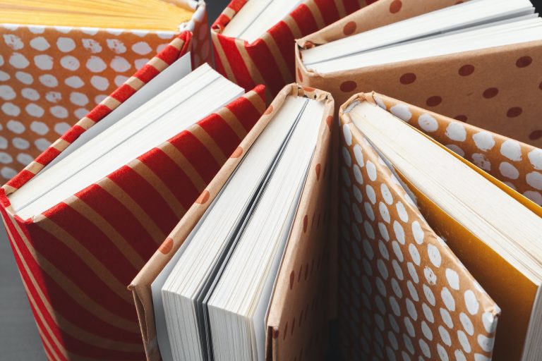 paperback books on a table